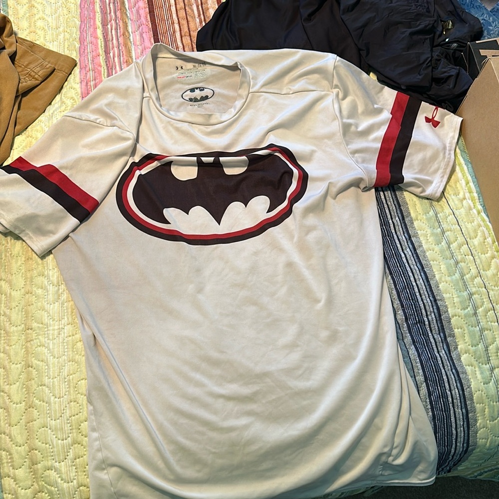 Gently used men’s athletic shirt. Has a pen mark on back. See picture